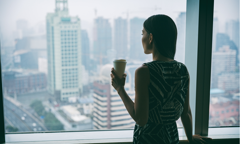 mental health for lawyers. Lawyer looking out the window at the office